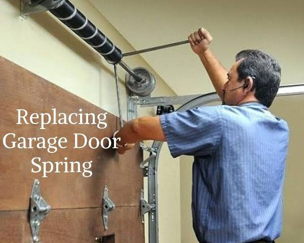 Technician replacing a garage door spring in lynnwood